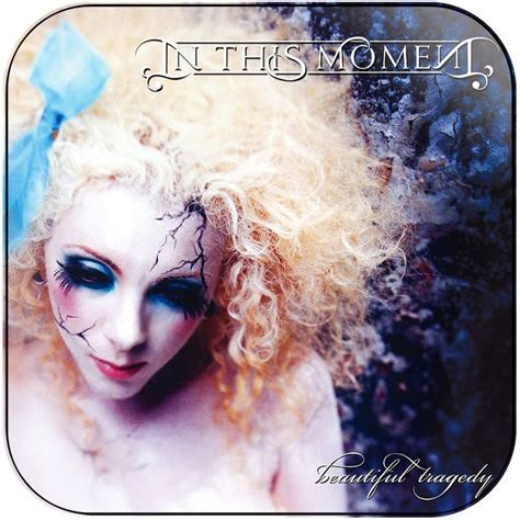A Woman With Long Blonde Hair And Blue Makeup Is Posing For The Cover