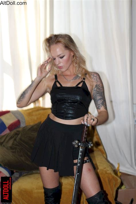Stunning Blonde Chick Playing With A Big Sword And Posing 15 Photos