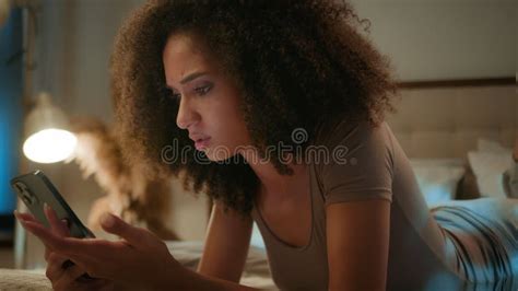 African American Girl Scrolling Smartphone Mobile Phone Online Apps In