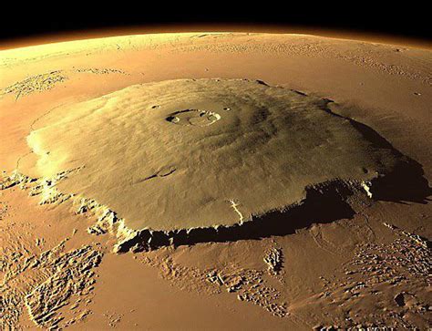 Olympus Mons of Mars, the tallest volcano in our Solar System. 16 miles ...