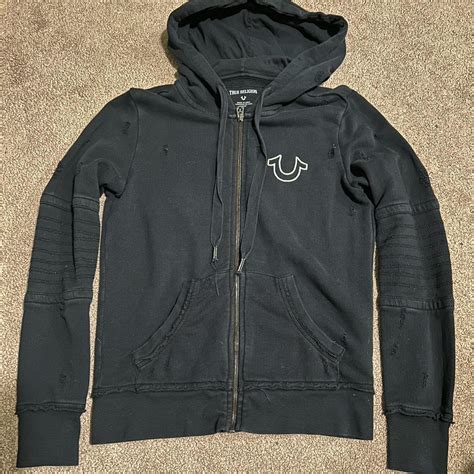 True Religion zip up hoodie distressed small holes... - Depop