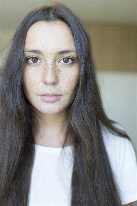 Close Up Portrait Of Beautiful Young Woman With Long Brown Hair At Home