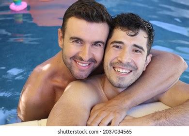 Gorgeous Interracial Gay Couple Swimming Pool Stock Photo