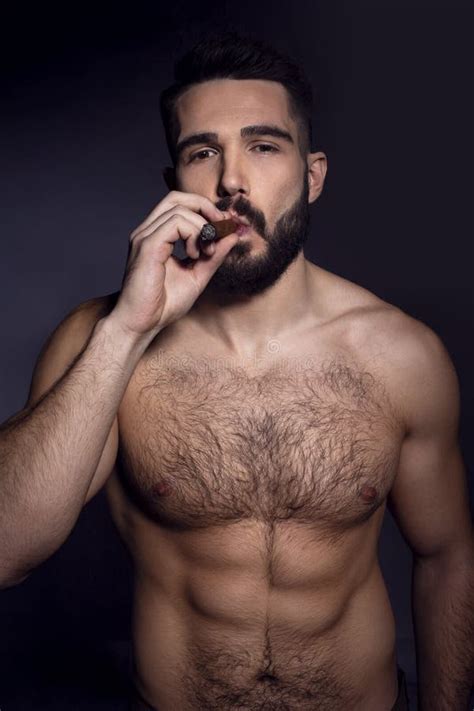 Closeup Portrait Of A Brutal Handsome Bearded Man With Naked Torso Smoking A Cigarette Male