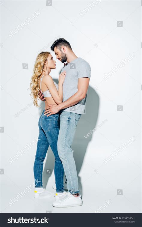 Handsome Man Hugging Attractive Blonde Girl Stock Photo 1394610041 Shutterstock