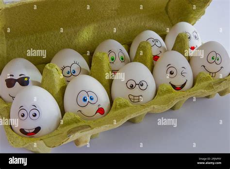 Funny white easter eggs in box Stock Photo - Alamy