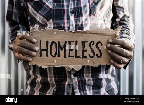 Homeless Man Holding Sign Stock Photo Alamy