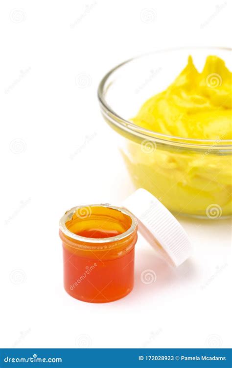 Opened Pot Of Yellow Gel Food Coloring For Baking Isolated On A White