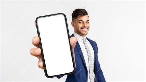 Premium Photo Happy Arab Man Smiling And Showing Cell Phone Mockup