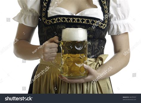 Bavarian Woman In Dirndl Holds Beer Stein In Front Of Breast At