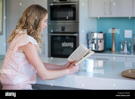 Pretty Blonde Reading A Book Stock Photo Alamy