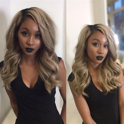 Long Sexy Wavy Layered Cut With Ash Blonde Color And Black Shadow Roots The Latest Hairstyles