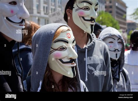 A Group Of People Wearing Guy Fawkes Masks At A Rally Stock Photo Alamy