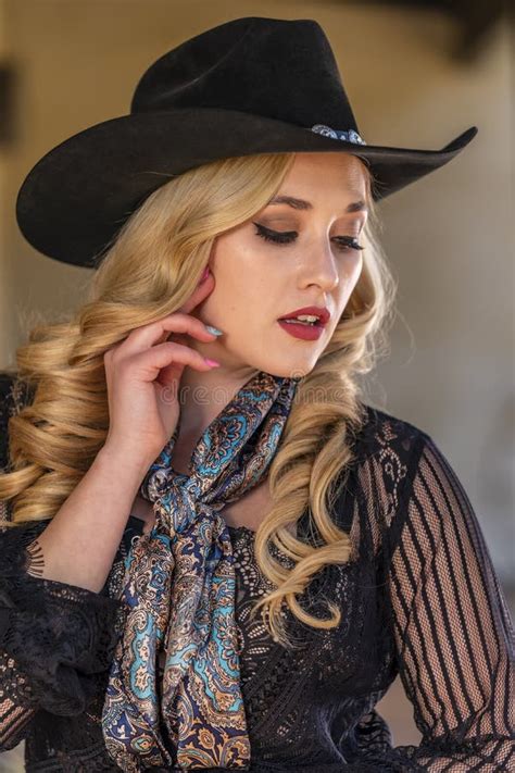 A Lovely Blonde Model Dressed As A Cowgirl Enjoys The American West Stock Photo Image Of