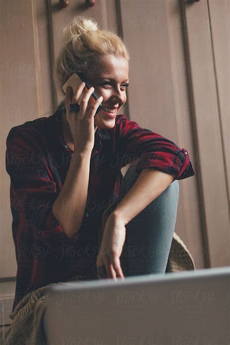 Pretty Blonde Woman Making A Phone Call By Stocksy Contributor