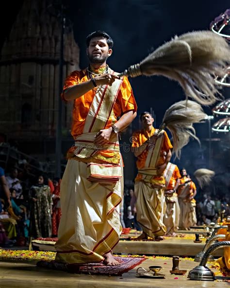 Priests Performing Ganga Aarti On Banks Of Holy River Ganges In One Of