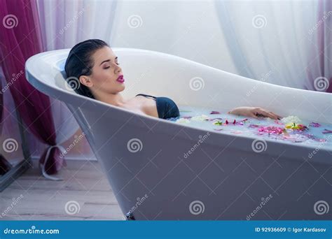 Brunette Woman Relaxing In A Hot Bath With Flowers Stock Image Image Of Delight Back