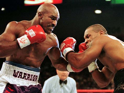 Evander Holyfield was ready to bite Mike Tyson in the face until a