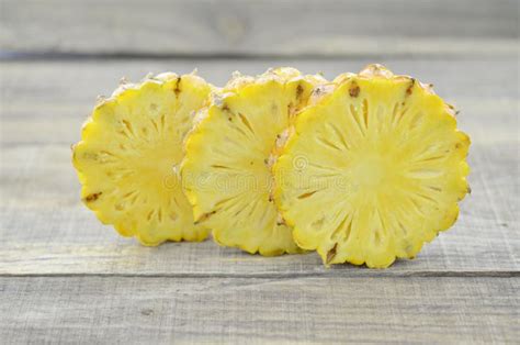 Fresh Pineapple Cut Slices on Wooden Table Stock Image - Image of ...