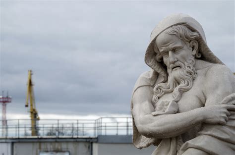 statue  man photo  grey image  unsplash