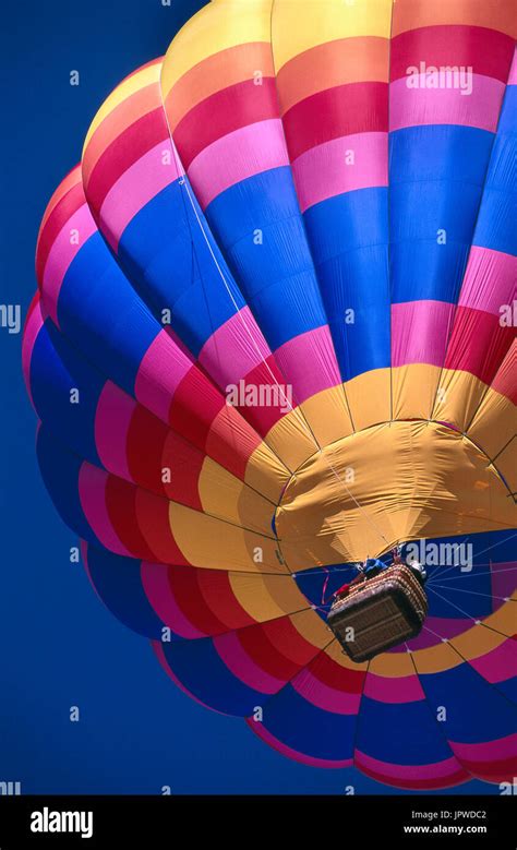 Hot Air Balloon With Wicker Basket Flying Enroute At The Albuquerque International Balloon