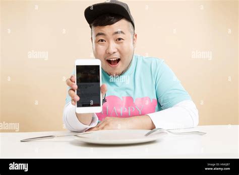 Little Fat Man Using A Cell Phone Stock Photo Alamy