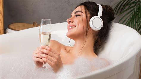 Wife Settles Into Hot Bubble Bath To Relax With A Glass Of Wine And A Podcast About A Horrific