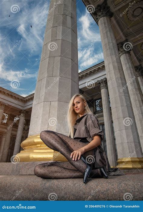 Beautiful Blonde Woman With Perfect Legs In Pantyhose Posing Outdoor At The Autumn Street Stock