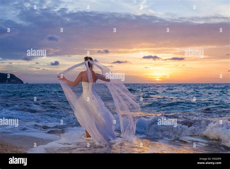 Beautiful Bride On The Beach At Sunset Stock Photo Alamy