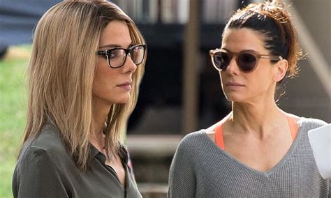 Sandra Bullock Gets Into Character With A Blonde Wig And Glasses For