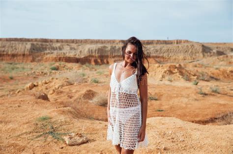 Portrait Of Beautiful Tanned Brunette Woman Outdoors Stock Photo