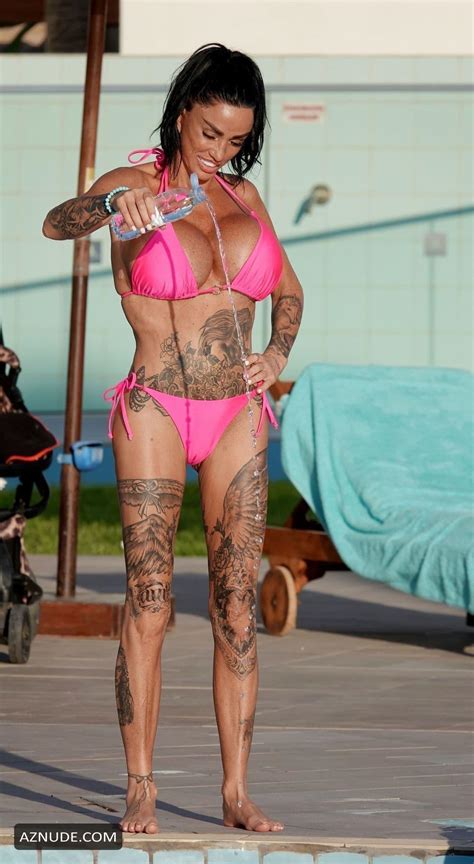 Katie Price Sexy Spotted Showing Off Her Busty Assets Wearing A Sultry Pink Bikini At A Pool In