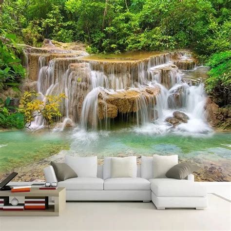 A Living Room With A Couch And Wallpaper That Has A Waterfall In The Middle