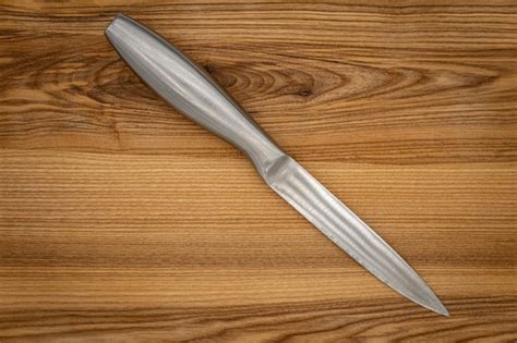 Premium Photo Big Kitchen Knife Lying On A Cutting Board Gray Kitchen