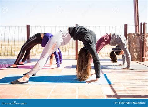 Women Doing Upward Bow Yoga Pose Stock Photo Image Of Workout