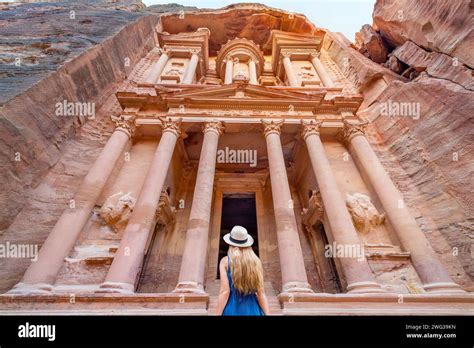 Petra Jordan A Blonde Haired Woman Looks Up At The Treasury In Petra Jordan Stock Photo Alamy