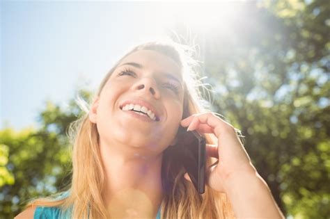 Premium Photo Fit Blonde Talking On Her Smartphone