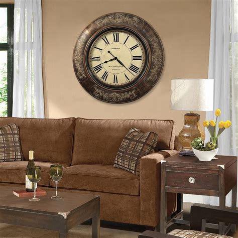 A Living Room Filled With Furniture And A Large Clock On The Wall Above