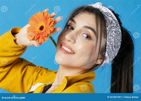 Elegant Brunette Lady With Glamour Makeup Posing Indoors Holding Bright Flower Smiling Stock