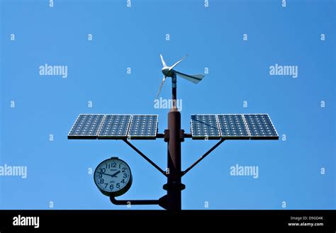 Wind-solar hybrid power generation clock Stock Photo - Alamy