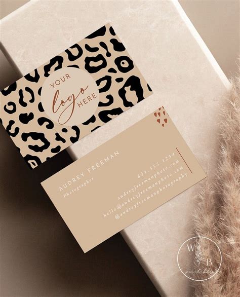 A White Box With A Leopard Print On It And A Business Card Next To It