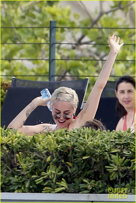 Miley Cyrus Displays Her Amazing Bikini Body Douses Herself With Water While Hanging Poolside