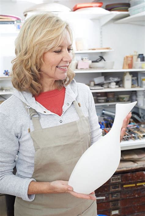 Mature Woman Holding Vase In Pottery Studio Stock Image Image Of