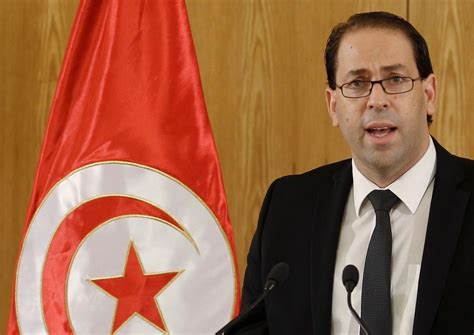 tunisian premier presents  cabinet appoints  finance minister