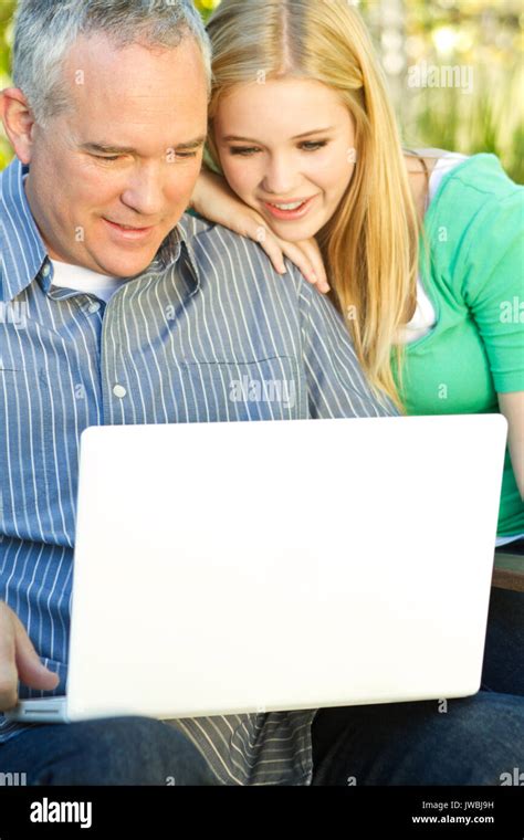 Happy family smiling Stock Photo - Alamy