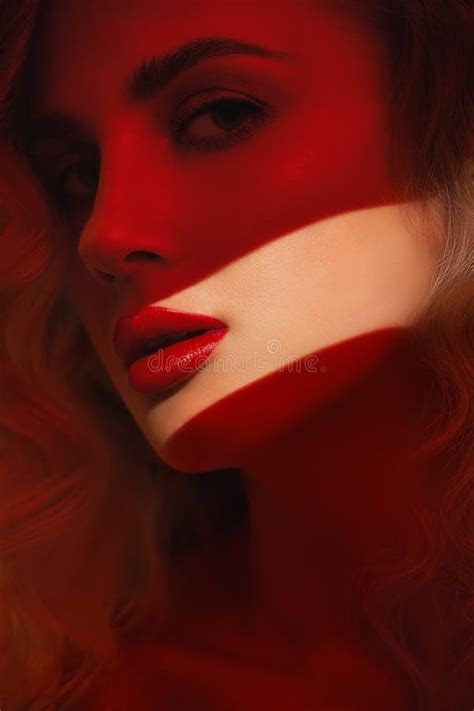Bright Red Lips Of Blonde Woman Highlighted By A Streak Of Light Stock Photo Image Of Face