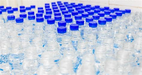 Lots Of Water Bottles Bottles With Blue Caps Bottling Plant Water