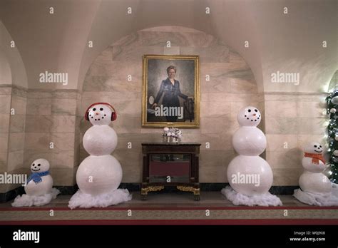 A portrait of former First Lady Hillary Clinton is seen alongside ...