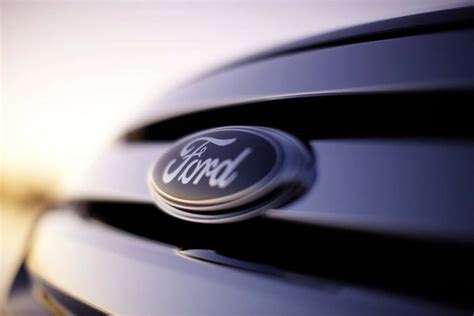 Download Ford Logo: Embodying Power and Performance Wallpaper ...