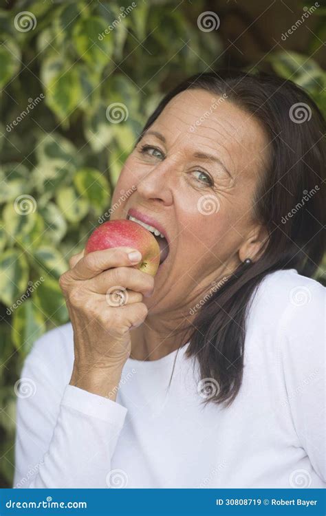 Happy Mature Woman Eating Apple Stock Image Image Of Confident Friendly 30808719